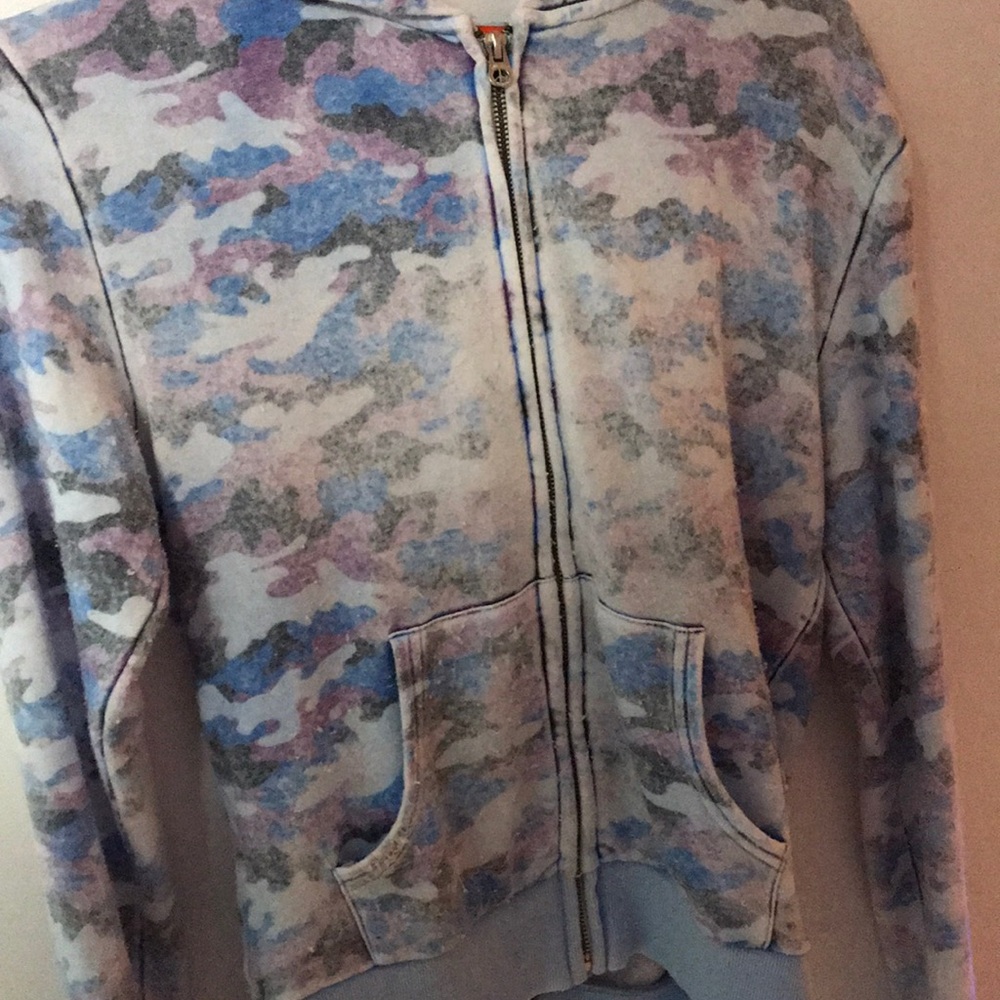 This is a faded purple and blue zip-up sweatshirt.